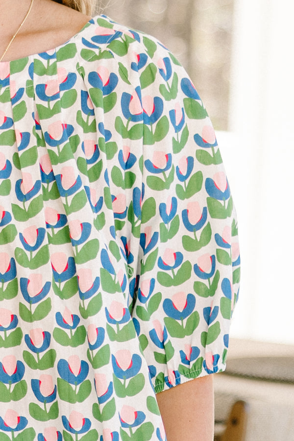 Chic Soul plus size clothing, green short sleeve top with pink/blue/green tulip design with round neckline with puff cuffed sleeves