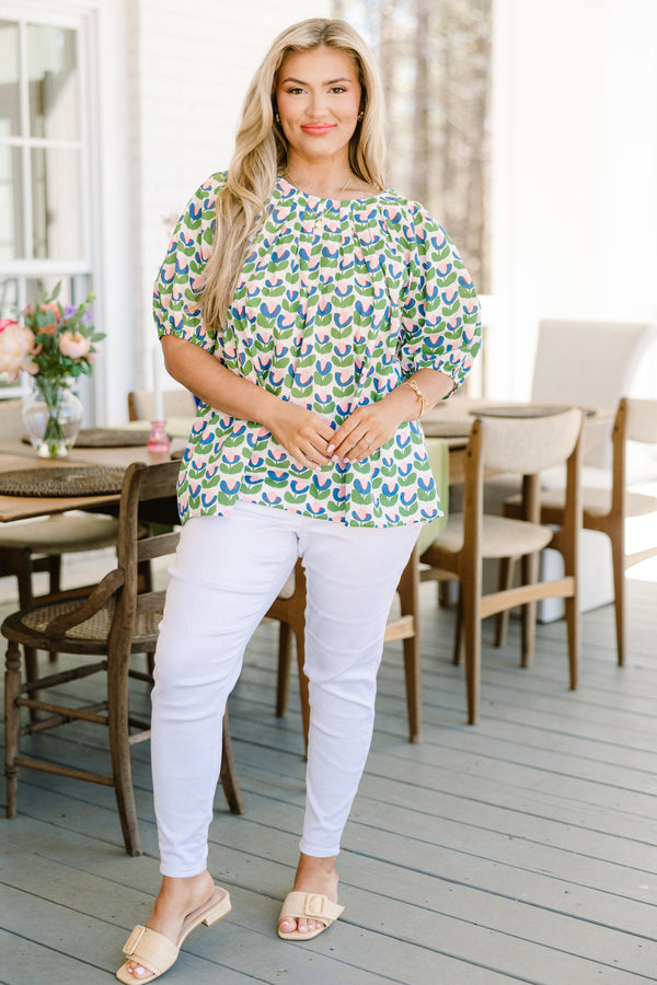 Chic Soul plus size clothing, green short sleeve top with pink/blue/green tulip design with round neckline with puff cuffed sleeves