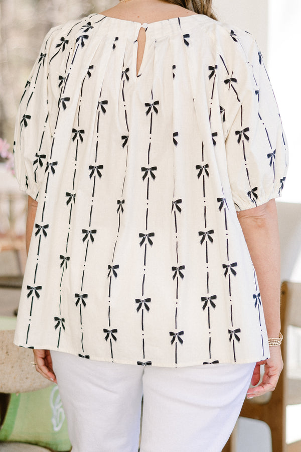 Chic Soul plus size clothing, ivory scoop neck short sleeve top with black bow design print with puff sleeves