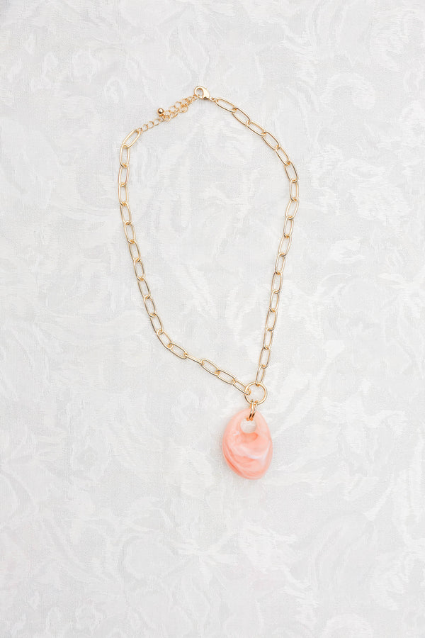 Chic Soul plus size clothing, gold and pink necklace that has a  pink marble stone attached to to gold chain 