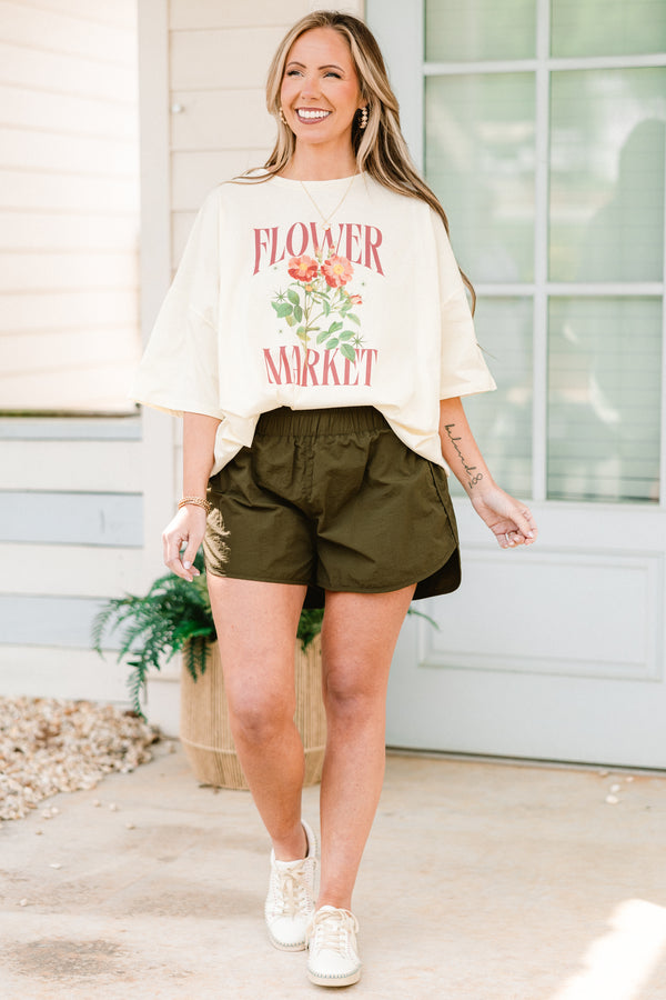Plus Size dark olive windbreaker shorts with a smocked waistband and slit hem.