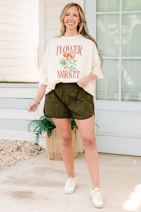 Plus Size dark olive windbreaker shorts with a smocked waistband and slit hem.