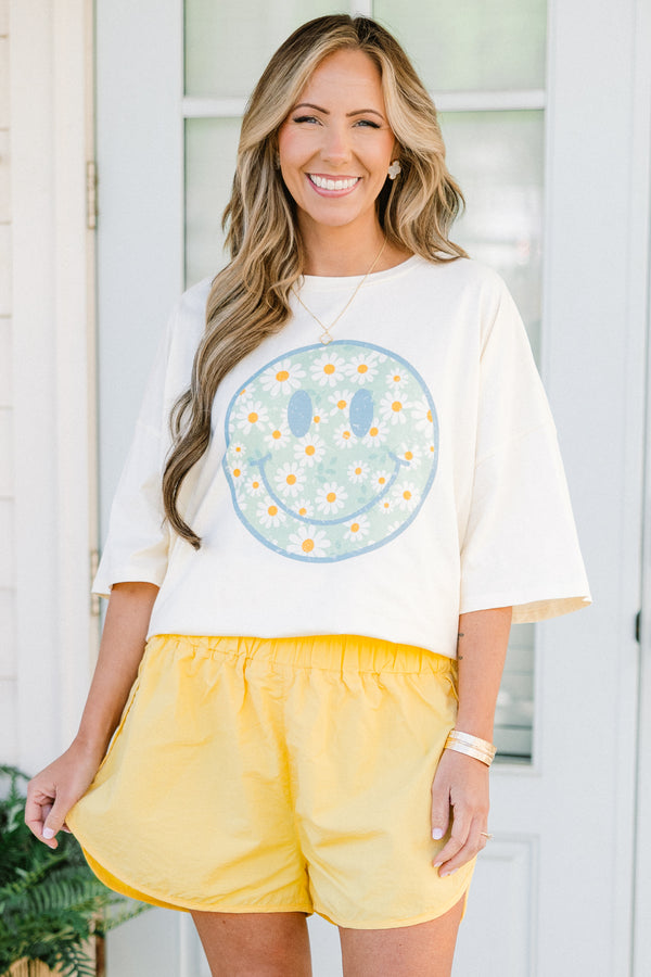 Chic Soul plus size clothing, high-waisted dusty banana yellow athletic shorts with a smocked high-waisted waistband with subtle flaring 