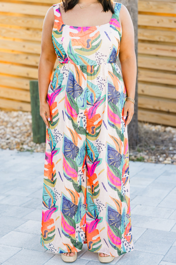 Chic Soul plus size clothing, sleeveless fuchsia multi-colored flowy wide-leg jumpsuit with a square-neckline and a strap with a multi-colored tropical floral pattern