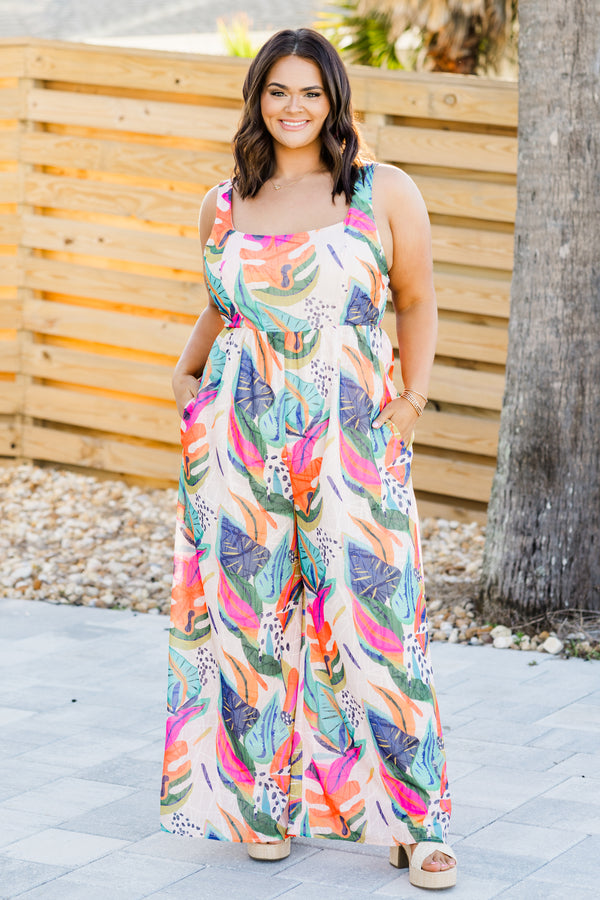 Chic Soul plus size clothing, sleeveless fuchsia multi-colored flowy wide-leg jumpsuit with a square-neckline and a strap with a multi-colored tropical floral pattern