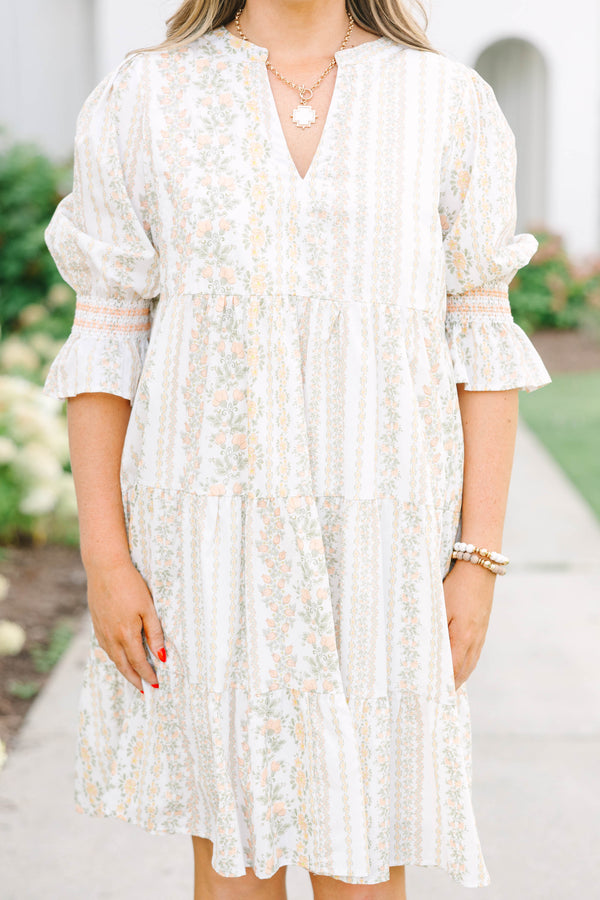 Plus Size cream tiered mini dress with a floral stripe pattern, V-neckline, and puff sleeves.