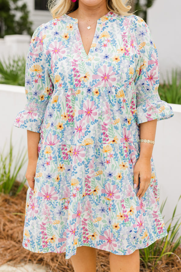 Chic Soul plus size clothing, cream multi colored baby doll dress with half sleeves that have a ruffle detail at the end of each sleeve and there is a floral pattern throughout the dress 