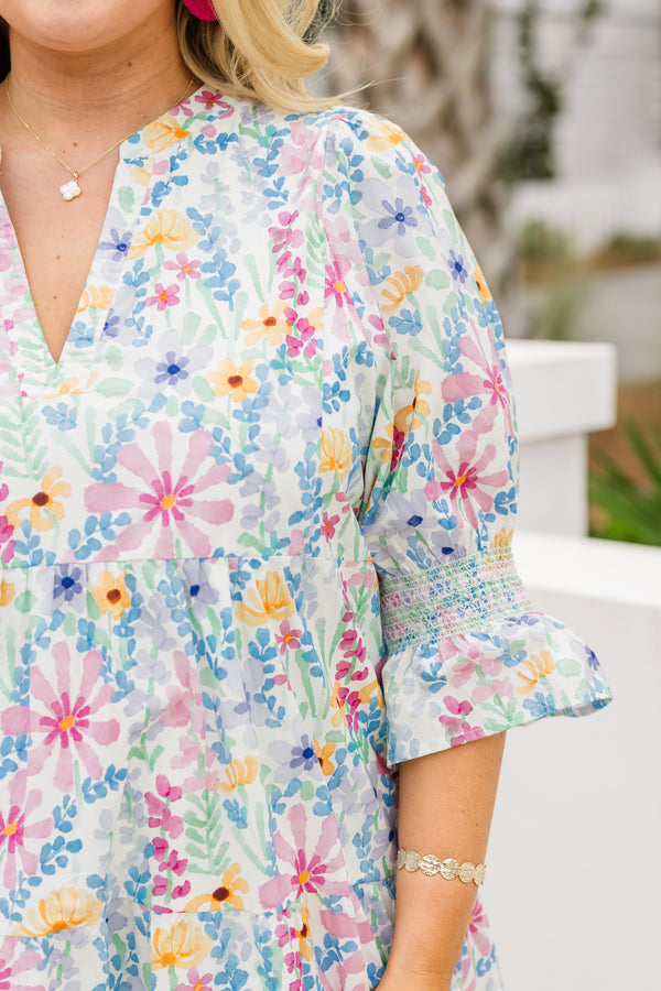 Chic Soul plus size clothing, cream multi colored baby doll dress with half sleeves that have a ruffle detail at the end of each sleeve and there is a floral pattern throughout the dress 