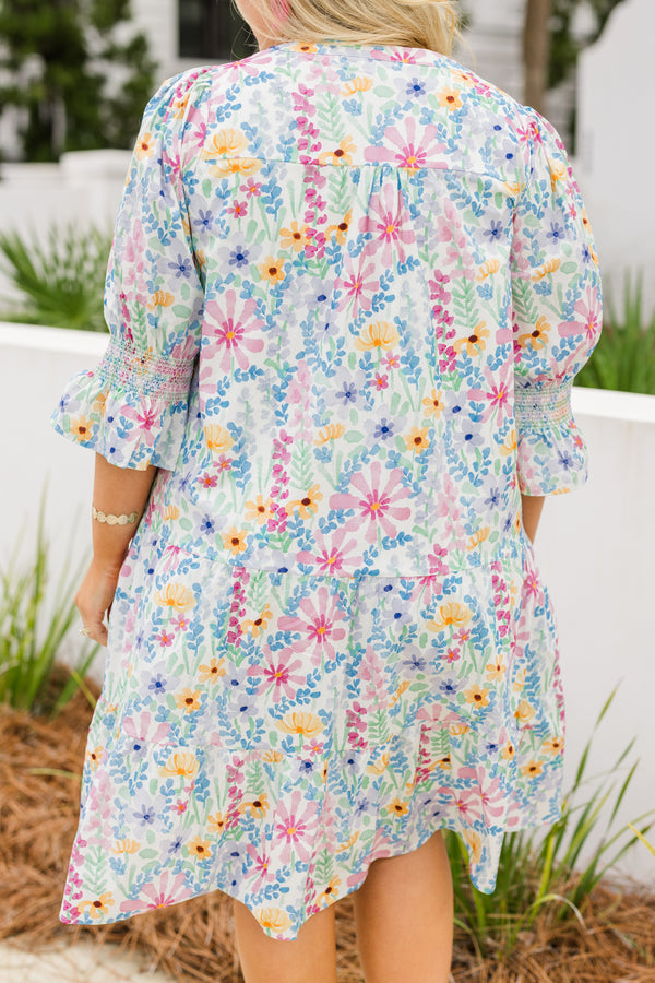 Chic Soul plus size clothing, cream multi colored baby doll dress with half sleeves that have a ruffle detail at the end of each sleeve and there is a floral pattern throughout the dress 