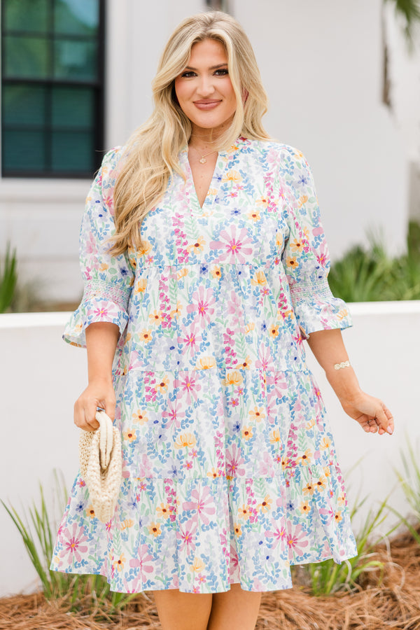 Chic Soul plus size clothing, cream multi colored baby doll dress with half sleeves that have a ruffle detail at the end of each sleeve and there is a floral pattern throughout the dress 
