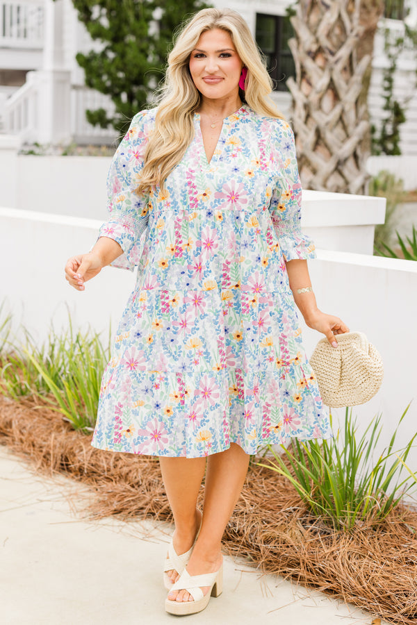 Chic Soul plus size clothing, cream multi colored baby doll dress with half sleeves that have a ruffle detail at the end of each sleeve and there is a floral pattern throughout the dress 