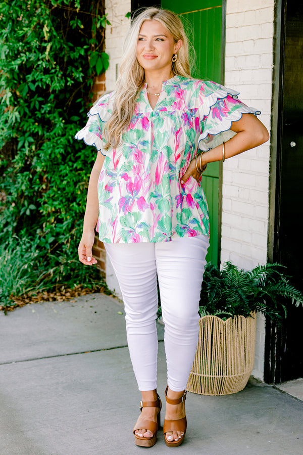 Chic Soul Plus size clothing, green blouse with a abstract flora pattern and flutter sleeves that have white scalloped ruffles on them that are outlined in blue stitching 
