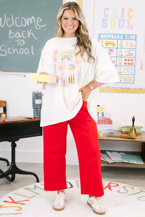 Plus size ivory oversized boyfriend tee with colorful school-themed graphics.