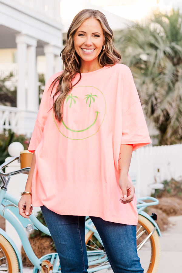 Chic Soul plus size clothing, neon coral pink boyfriend tee with green smiley face with palm trees as both eyes