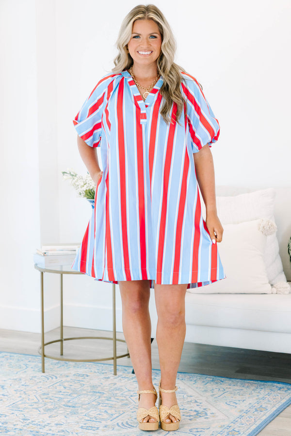Plus size blue and red vertical striped shift dress with puff sleeves and a v-neckline.