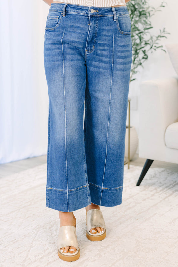 Plus Size wide-leg blue jeans with a front seam detail and a wide hem.