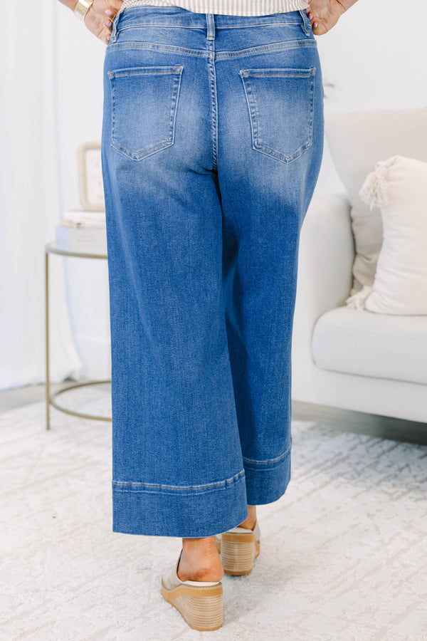 Plus Size wide-leg blue jeans with a front seam detail and a wide hem.