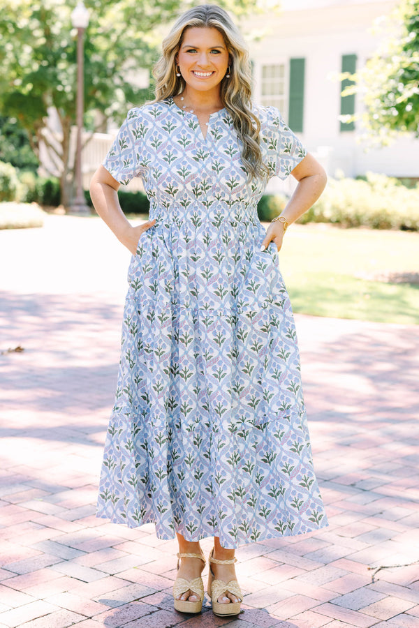 Plus Size blue and white floral print midi dress with short sleeves and a tiered skirt.