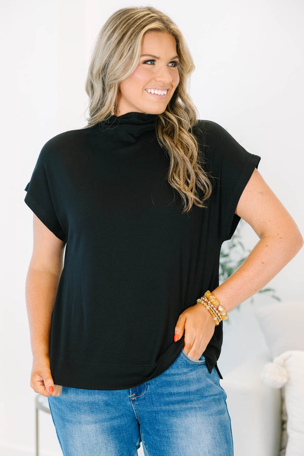 Plus Size black short sleeve mock neck top with a relaxed fit and side slits.