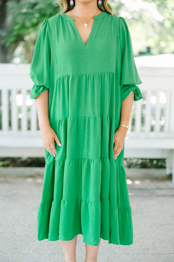 Plus Size green tiered midi dress with a V-neckline and three-quarter length sleeves.
