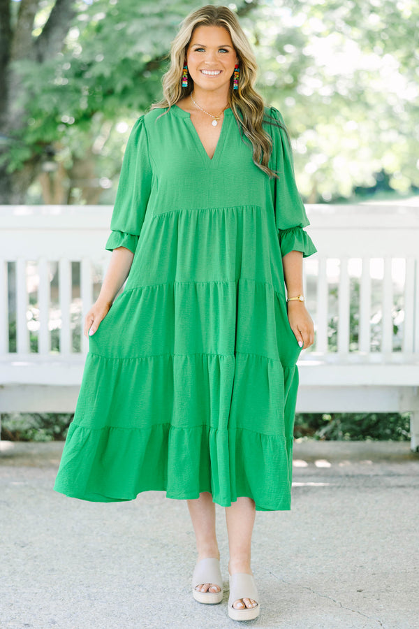 Plus Size green tiered midi dress with a V-neckline and three-quarter length sleeves.