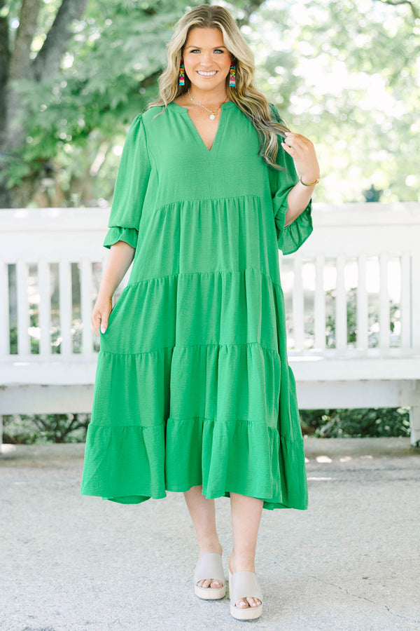 Plus Size green tiered midi dress with a V-neckline and three-quarter length sleeves.