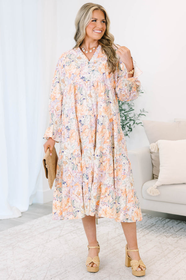 Plus Size tiered midi dress in a multi-color floral cotton fabric with long smocked cuff sleeves.