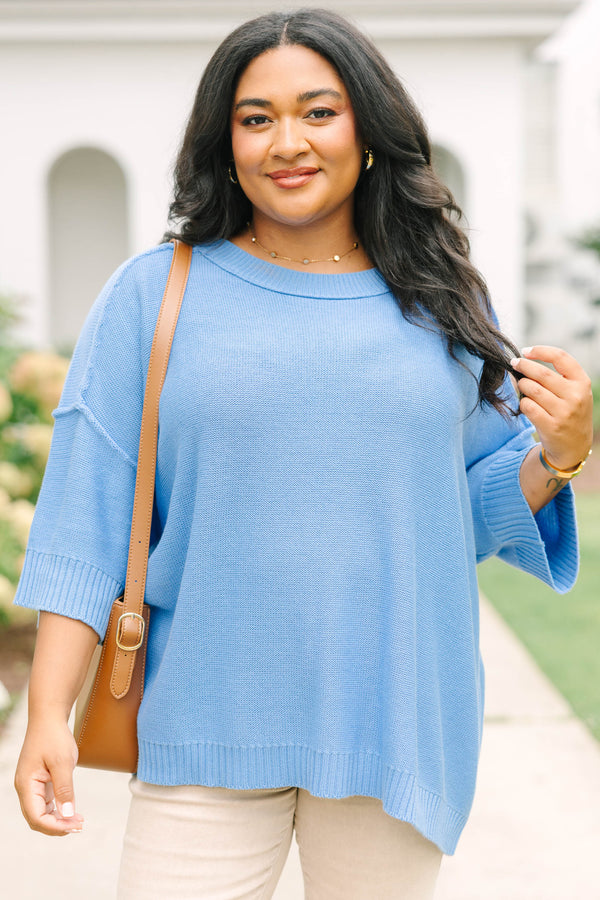 Plus size blue sweater, featuring a flowy fit and soft knit texture.