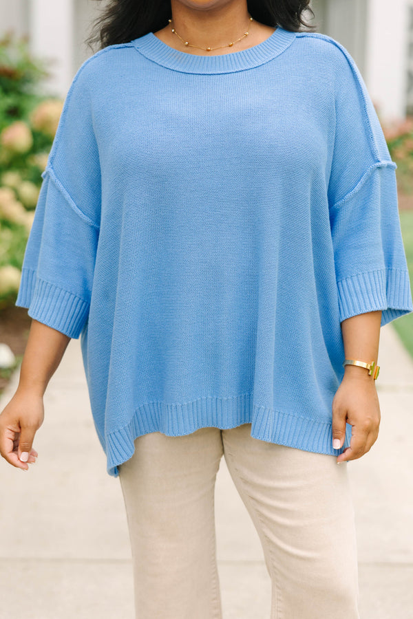Plus size blue sweater, featuring a flowy fit and soft knit texture.