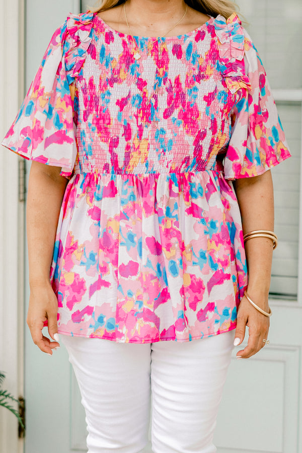 Chic Soul plus size clothing, light pink  short-flutter sleeve rounded neckline babydoll top with abstract warm magenta and cerulean pattern plus a ruched bodice and ruffles on the shoulders