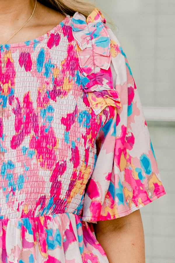 Chic Soul plus size clothing, light pink  short-flutter sleeve rounded neckline babydoll top with abstract warm magenta and cerulean pattern plus a ruched bodice and ruffles on the shoulders
