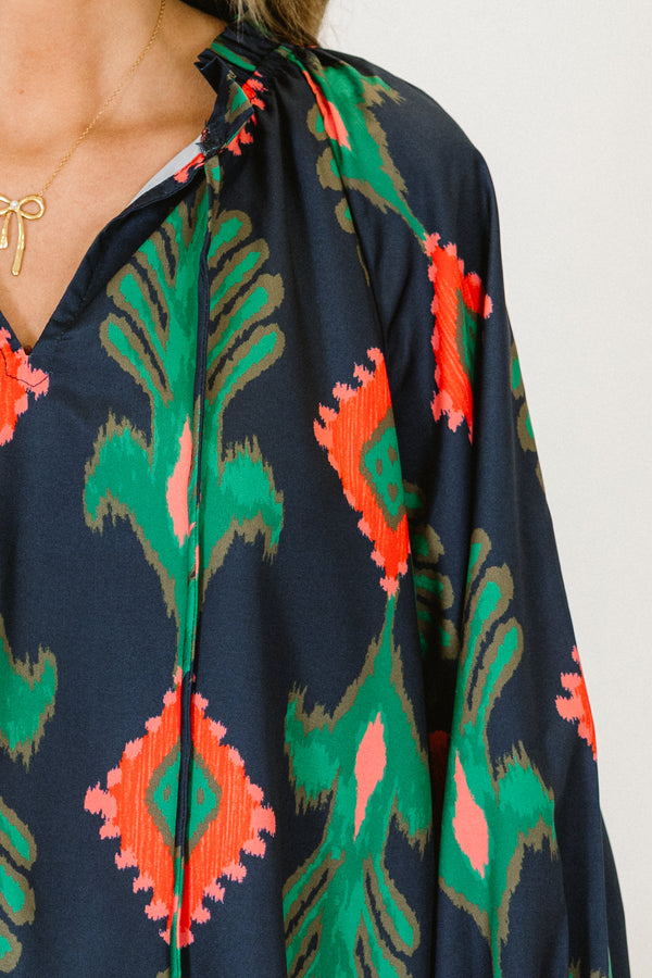 Chic Soul plus size clothing, navy blue long-balloon sleeve string tie v-neck top with abstract green and red-orange pattern