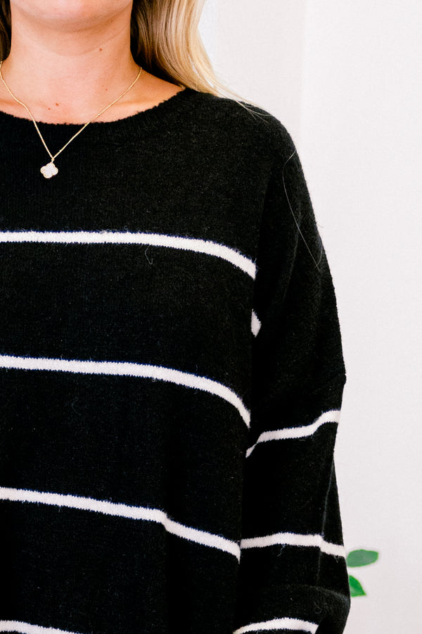 Plus Size black and cream striped sweater with a relaxed fit, crew neckline, and long sleeves.