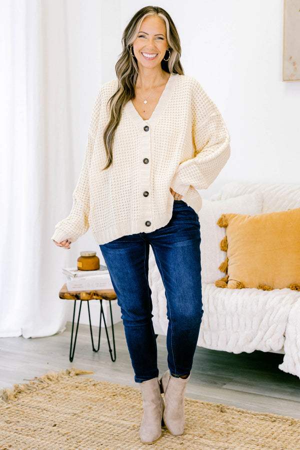 Chic Soul plus size clothing, white woven cardigan with buttons going down the center of the shirt and a slight v-neckline 