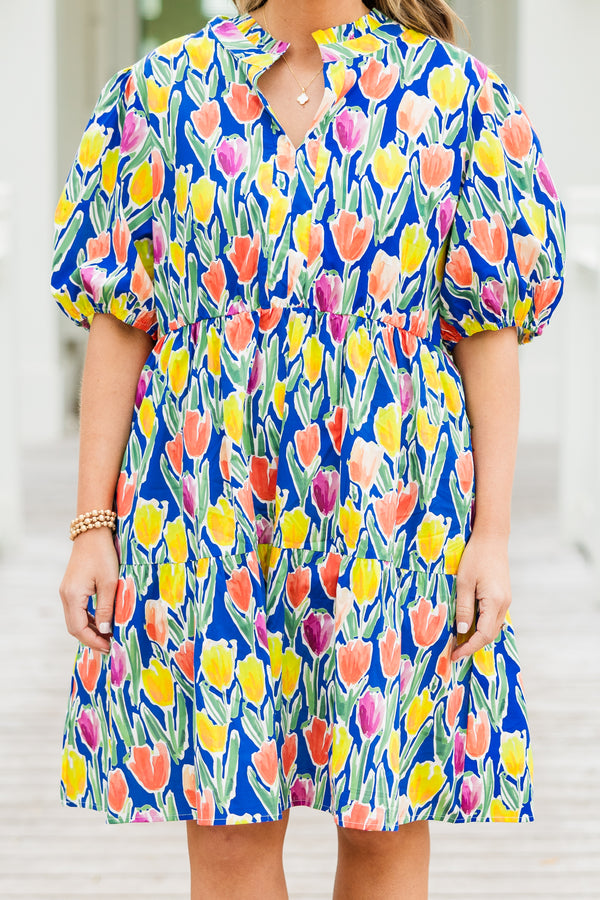 Chic Soul plus size clothing, blue short sleeve tiered mini dress with orange/yellow/pink floral tulip print with v cutout along neckline with puff sleeves