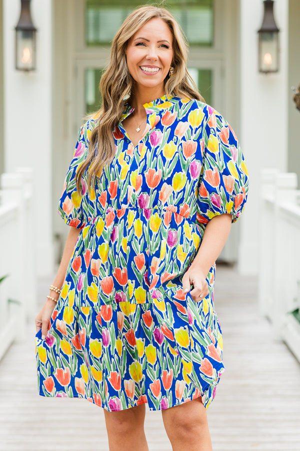 Chic Soul plus size clothing, blue short sleeve tiered mini dress with orange/yellow/pink floral tulip print with v cutout along neckline with puff sleeves