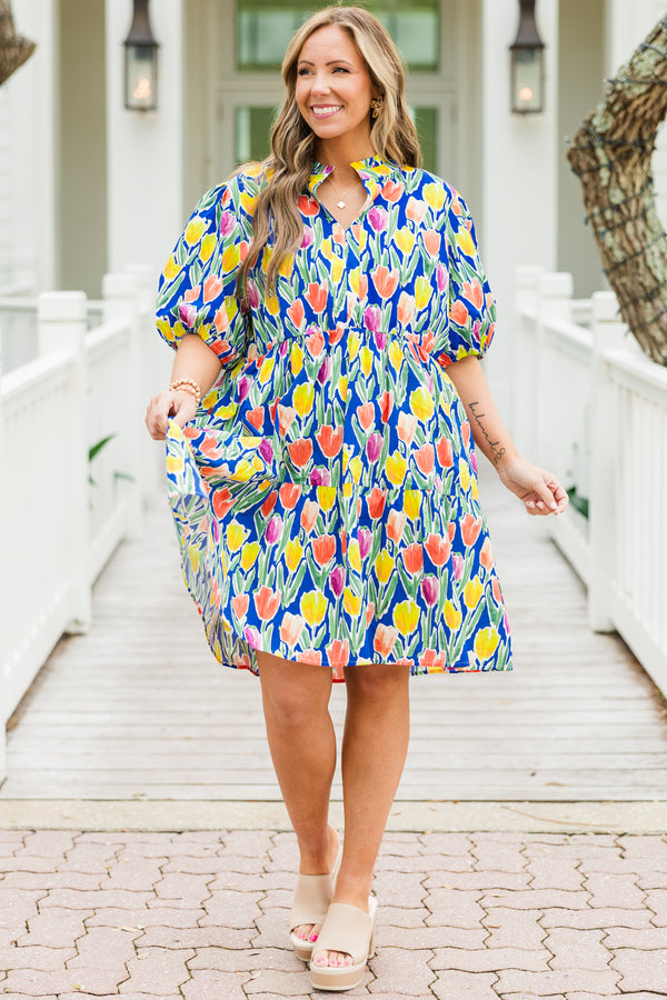 Chic Soul plus size clothing, blue short sleeve tiered mini dress with orange/yellow/pink floral tulip print with v cutout along neckline with puff sleeves