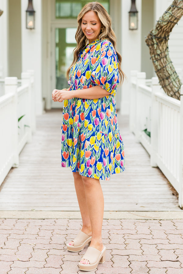 Chic Soul plus size clothing, blue short sleeve tiered mini dress with orange/yellow/pink floral tulip print with v cutout along neckline with puff sleeves