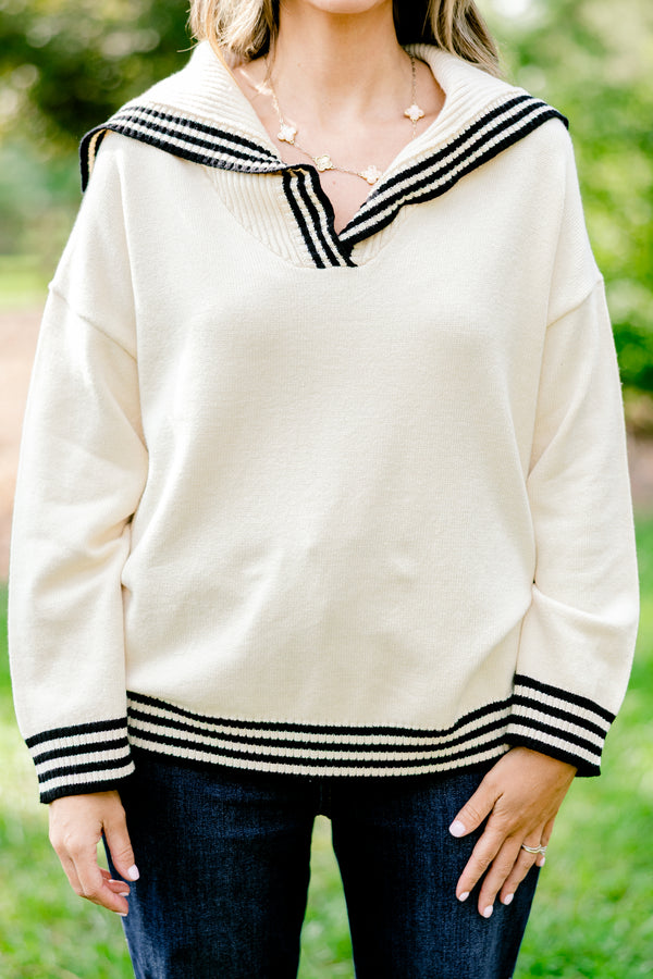 Chic Soul plus size clothing, off-white long sleeve hooded sweater with thin black stripes lining the hem, neckline, and sleeve
