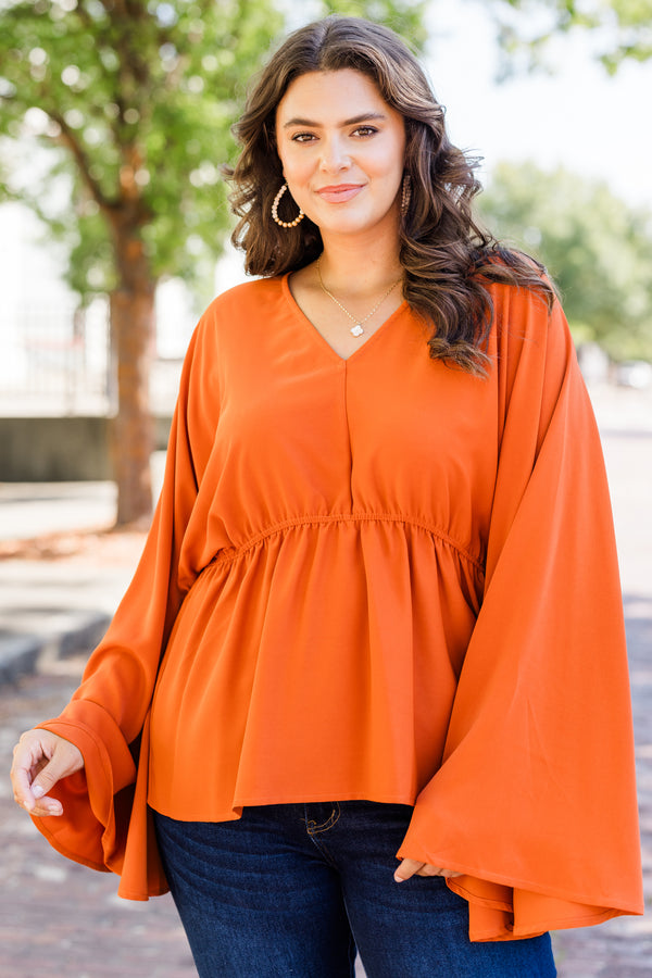 Chic Soul plus size clothing, orange long sleeve flowy top with v neckline and synched waist detail with bell sleeves