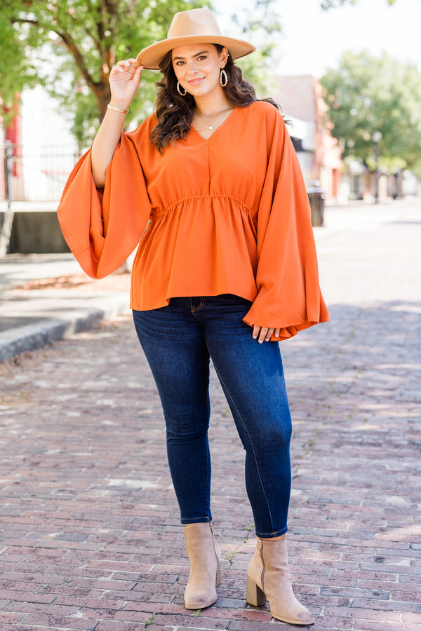Chic Soul plus size clothing, orange long sleeve flowy top with v neckline and synched waist detail with bell sleeves