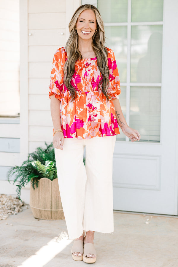 Chic Soul plus size clothing, pink/orange multi floral print peplum top with smocked chest detail with square neckline and puff sleeves with ruffle detail