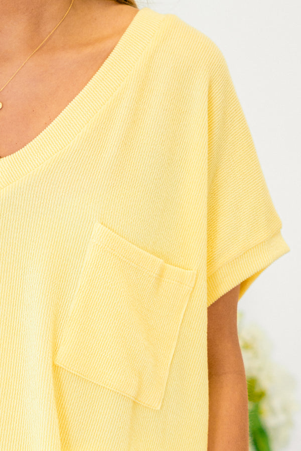 Chic Soul plus size clothing, short-sleeve butter yellow top with a v-neckline and a pocket on the bodice 