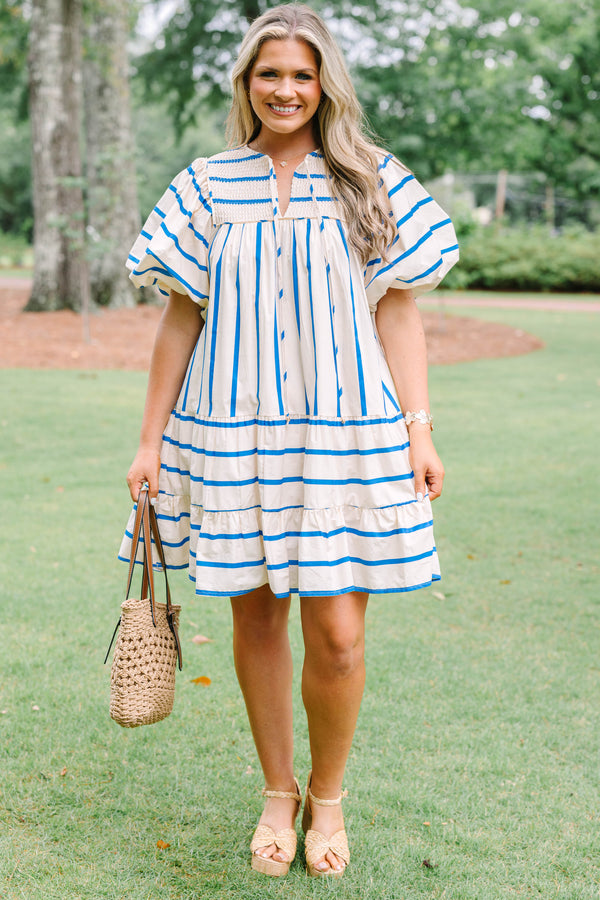 Plus Size blue and white striped cotton dress with smocked split neck and puff sleeves.