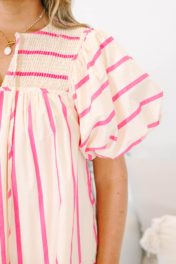 Plus Size pink and cream striped mini dress with puff sleeves, smocked yoke, and tiered skirt.