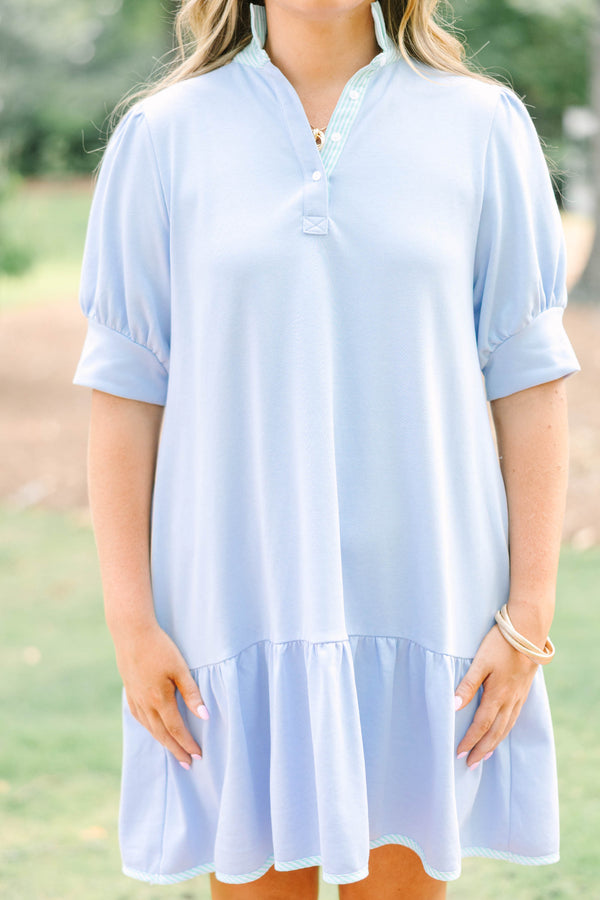 Plus Size light blue cotton dress with short puff sleeves, a collared neckline, and a ruffled hem.