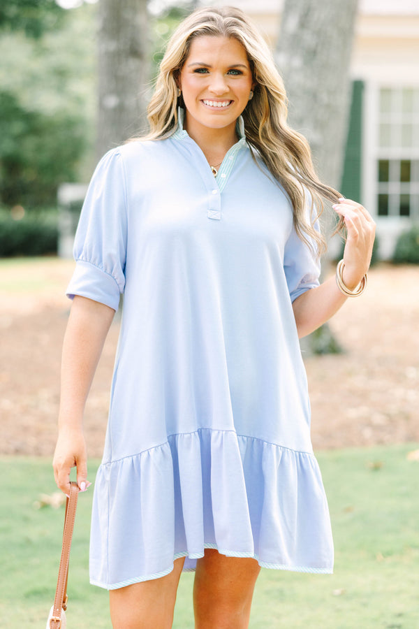 Plus Size light blue cotton dress with short puff sleeves, a collared neckline, and a ruffled hem.