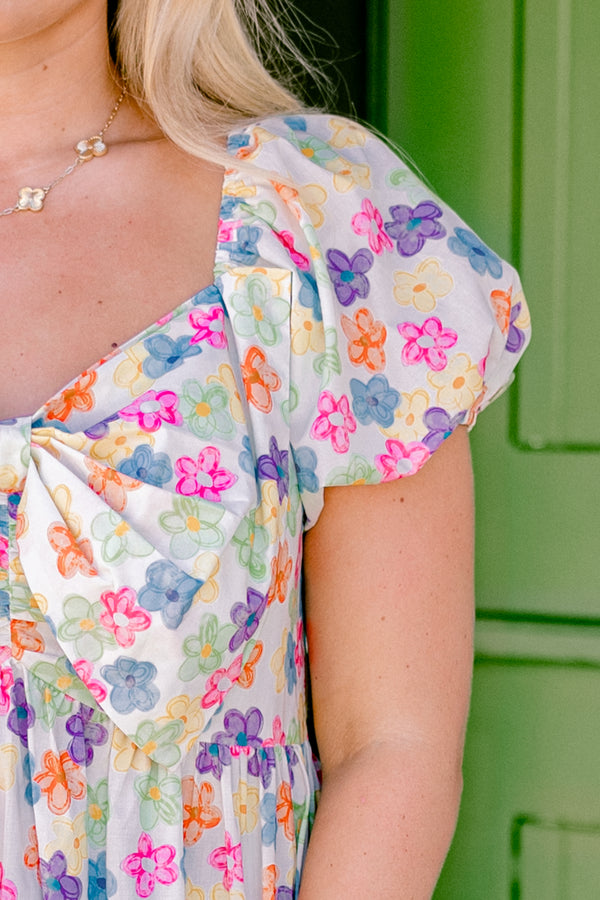 Chic Soul plus size clothing, ivory short-bubble sleeve sweetheart neckline casual top with multi-colored flower pattern and large bow detail near neckline