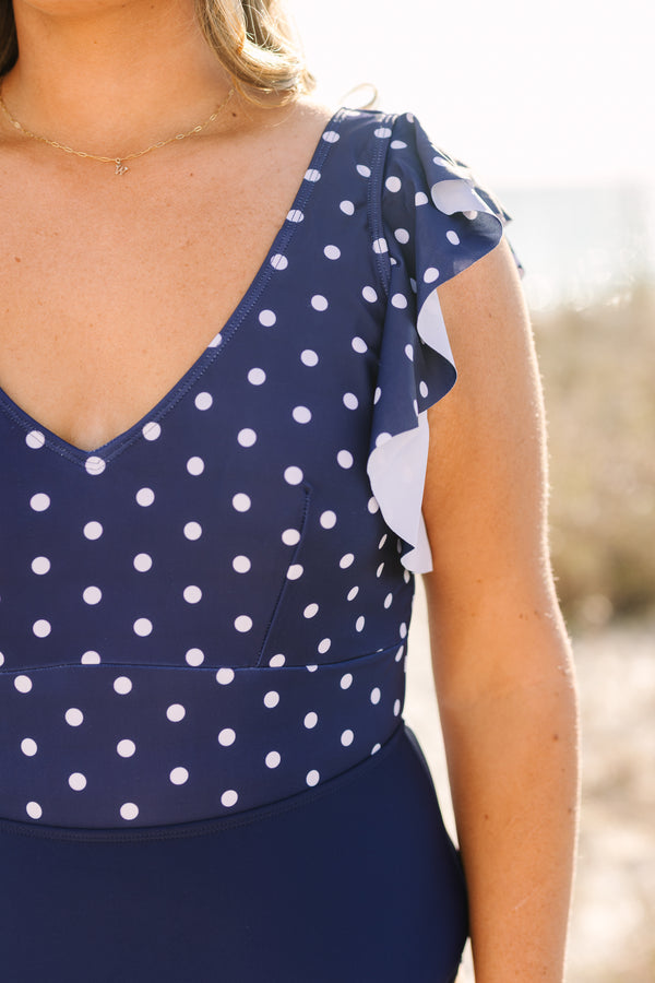 Chic Soul plus size clothing, solid navy blue low back one piece swimsuit with white polka dots on the upper half and ruffle sleeves