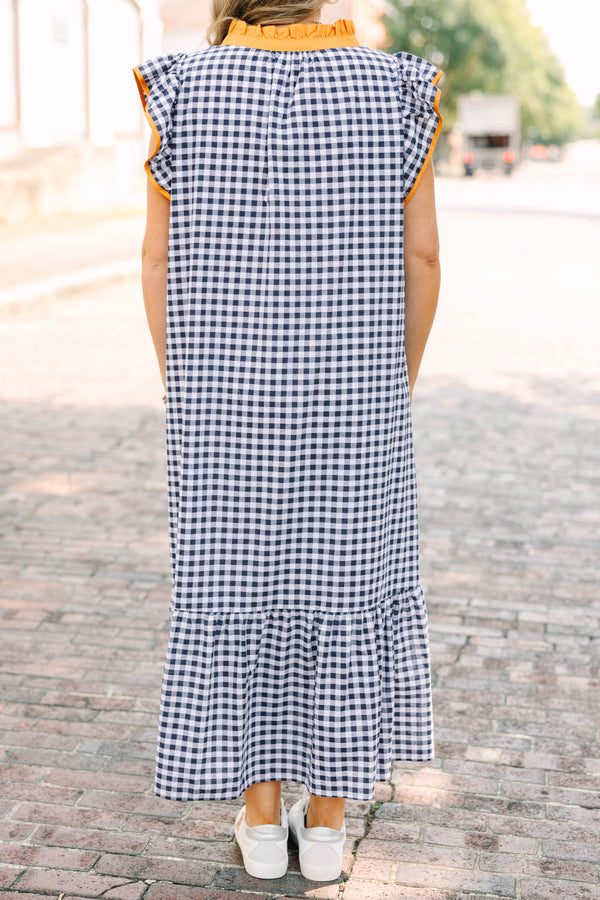Plus Size navy and white gingham maxi dress with orange ruffle sleeves and a buttoned orange collar.